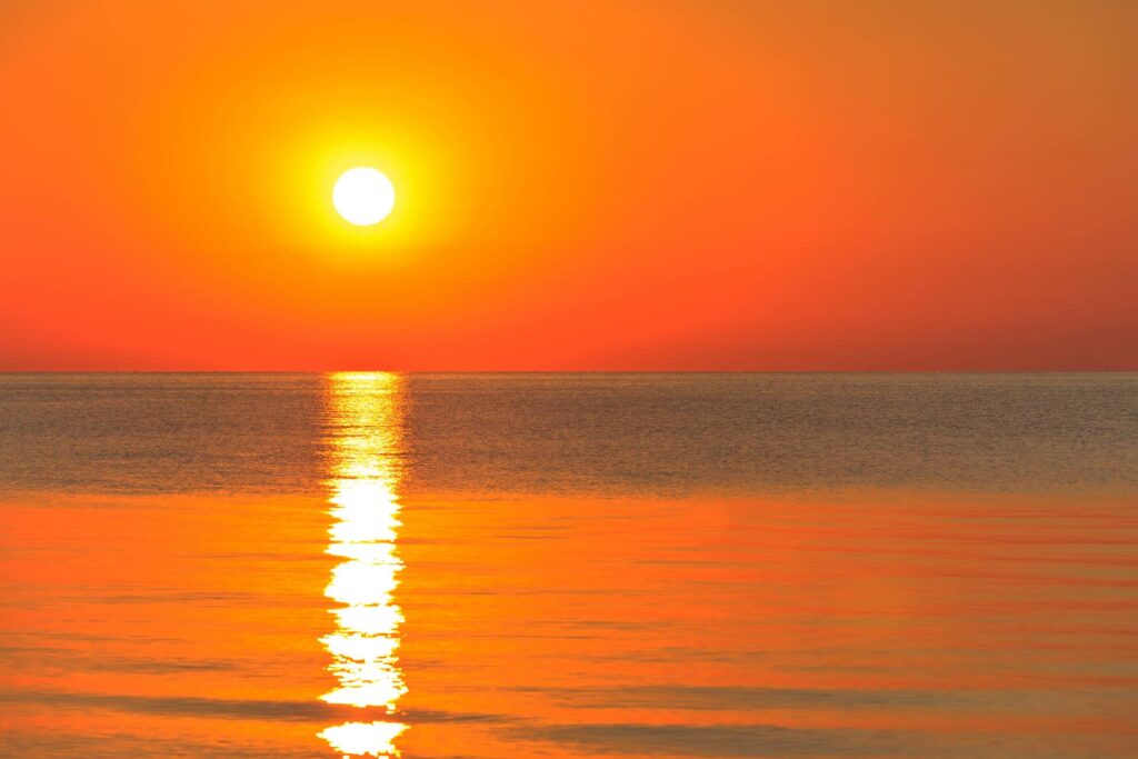 Sunset over an ocean.